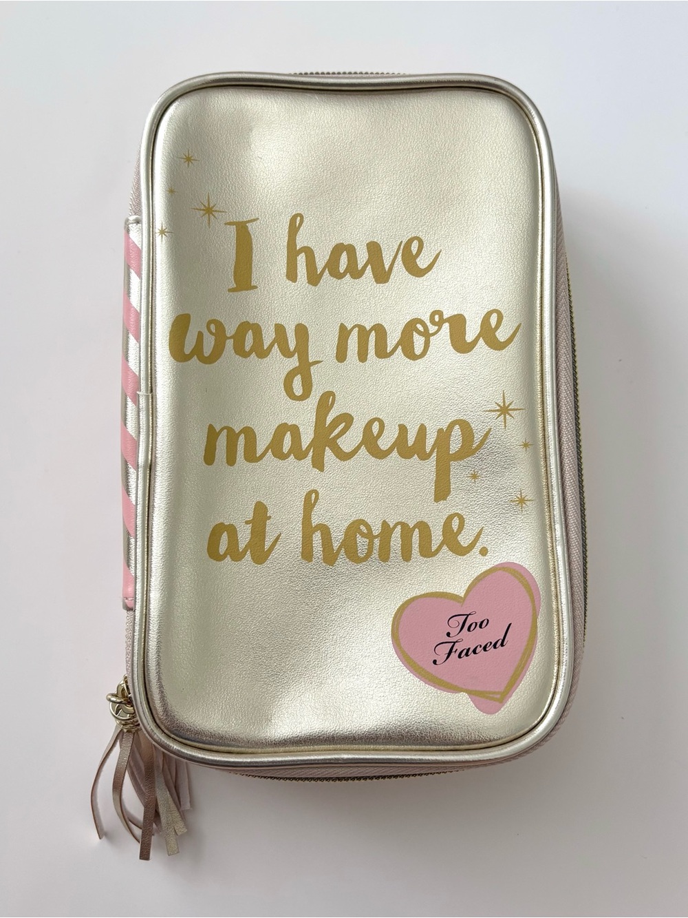 Too Faced pink and gold zip up makeup bag